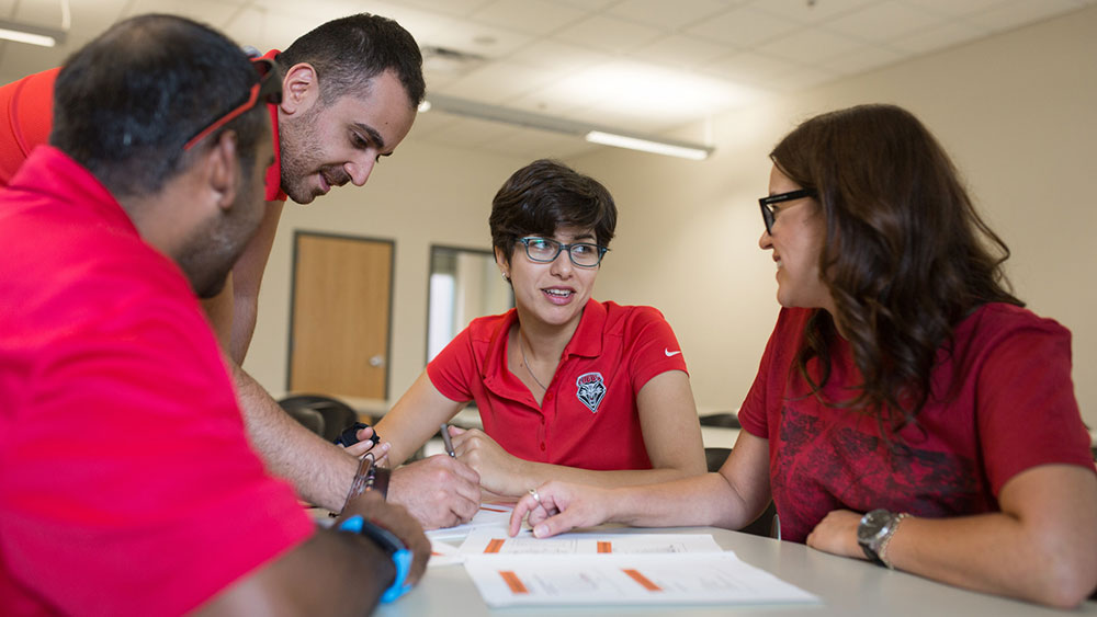 A group of students working on a project together at a table